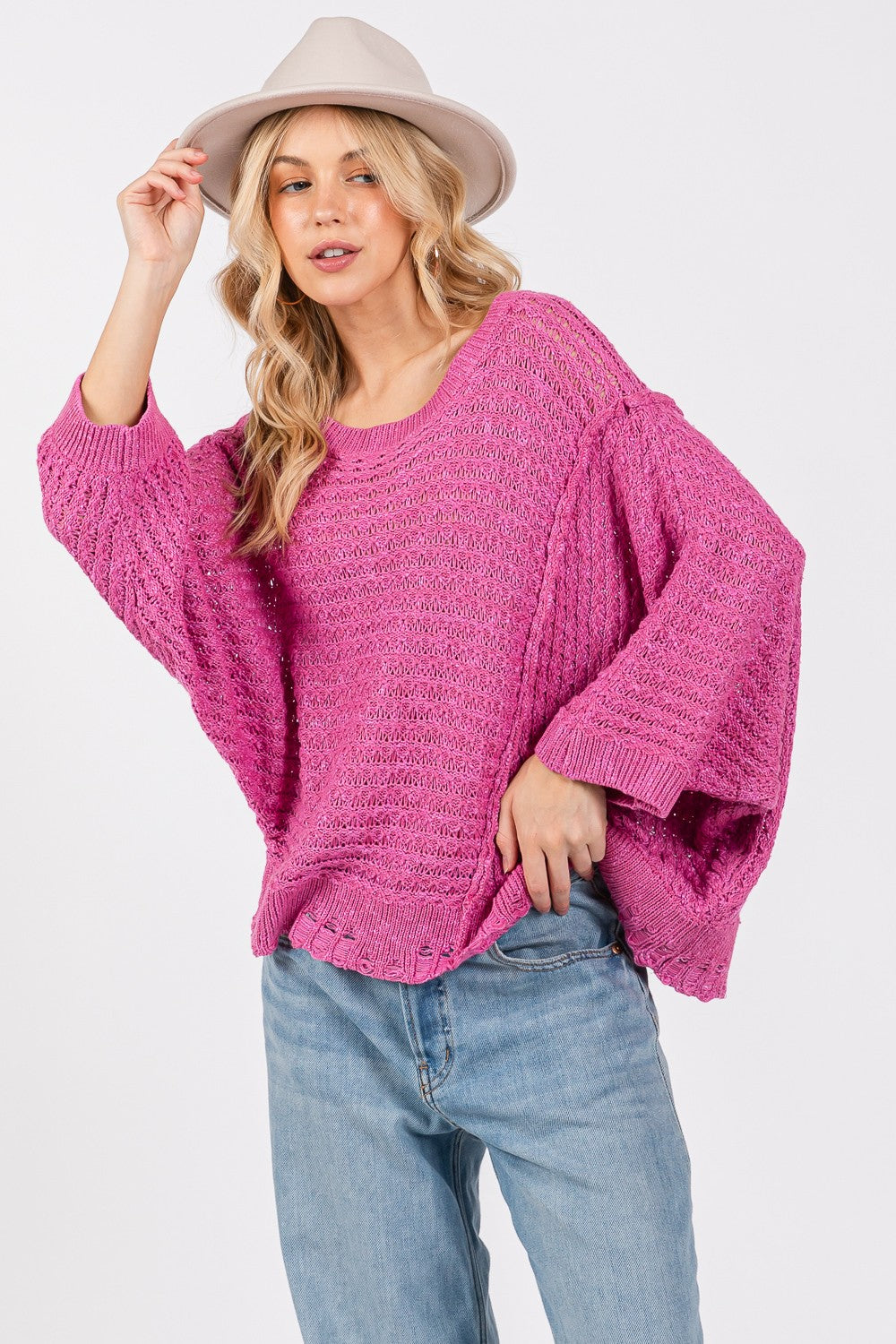 SAGE + FIG Distressed Asymmetrical Open Stitch Boat Neck Sweater in Magenta Pink