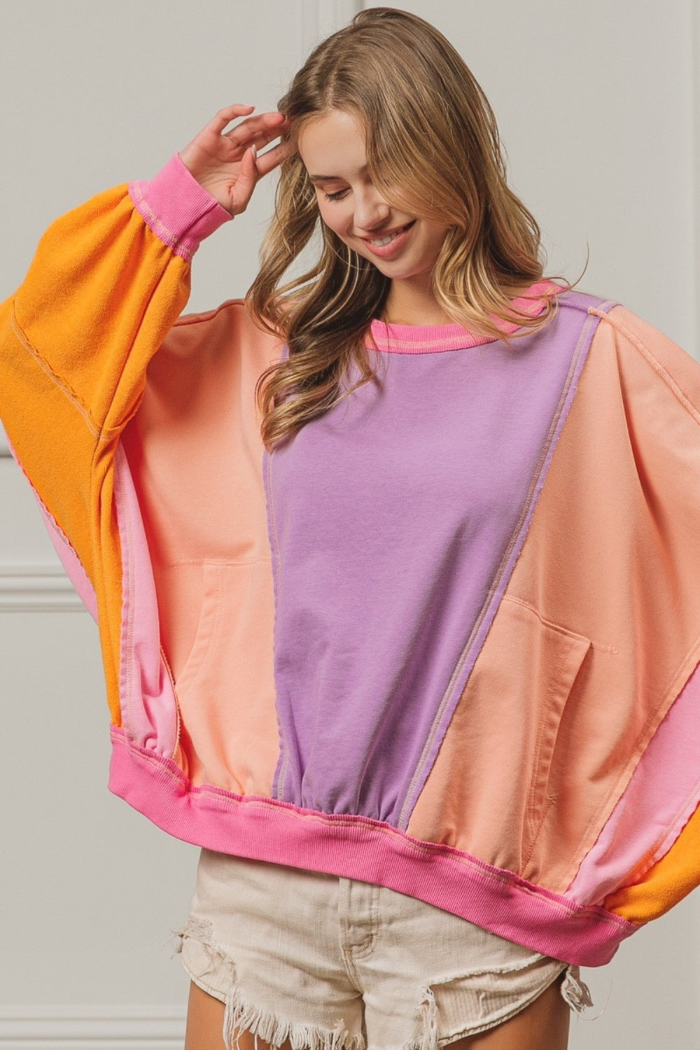 BiBi Oversized Color Block Exposed Seam Sweatshirt with Pockets in Peach Multi NWT