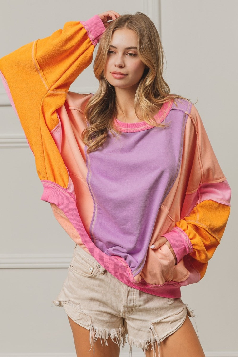 BiBi Oversized Color Block Exposed Seam Sweatshirt with Pockets in Peach Multi NWT