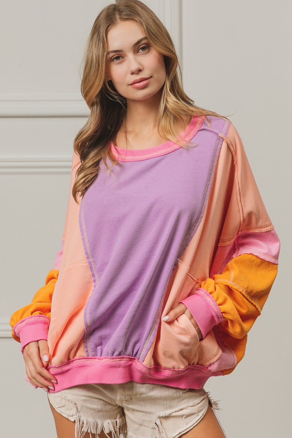 BiBi Oversized Color Block Exposed Seam Sweatshirt with Pockets in Peach Multi NWT