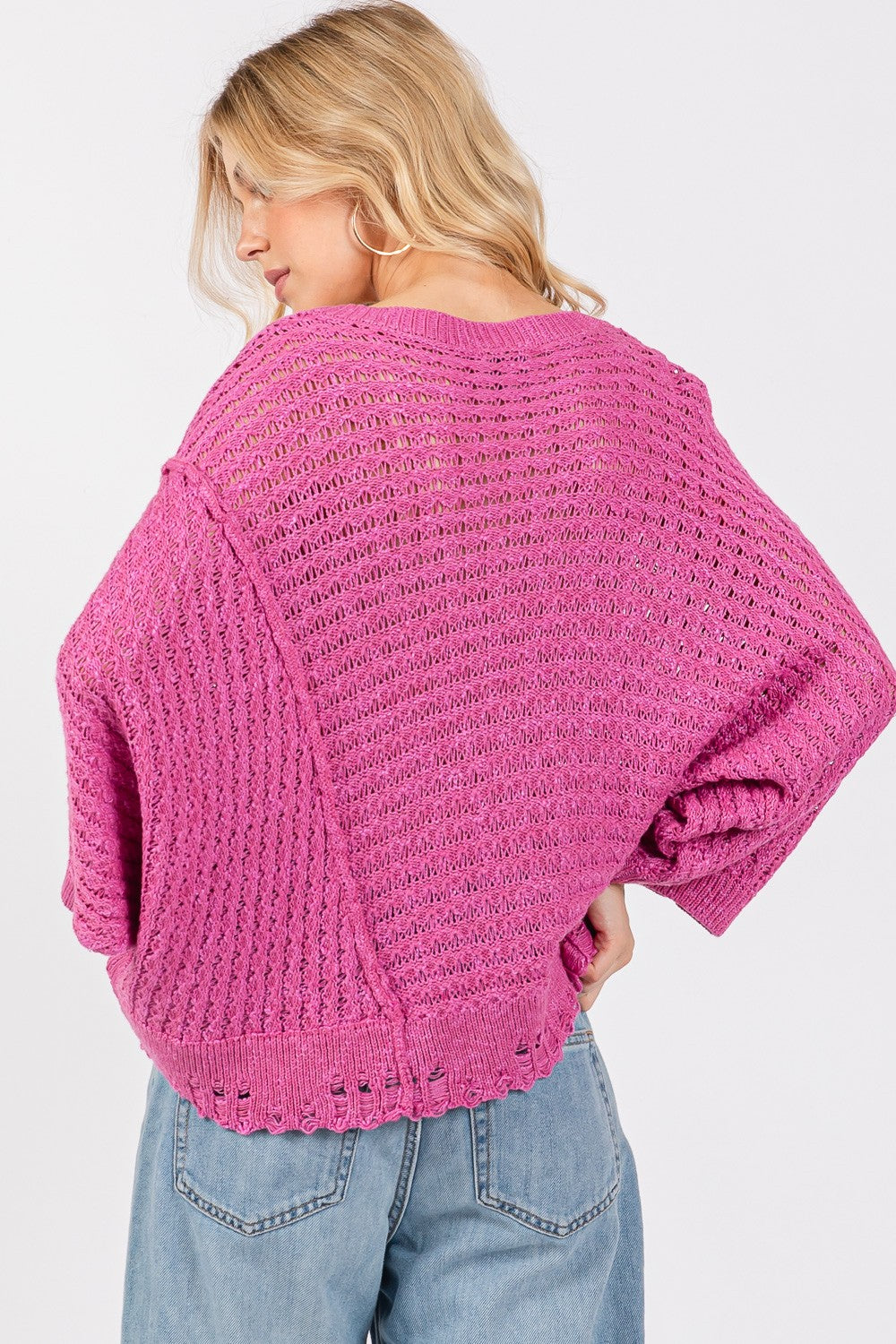 SAGE + FIG Distressed Asymmetrical Open Stitch Boat Neck Sweater in Magenta Pink