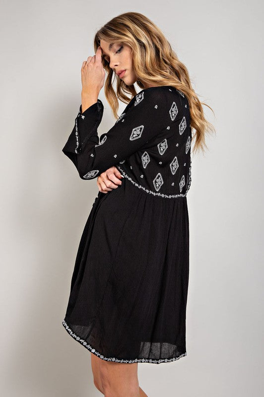 Sweet Generis Embroidered Long Sleeve Surplice Mini Dress in Black